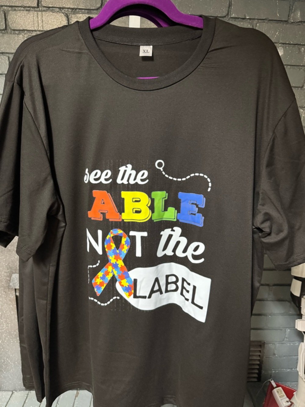 See The Able Not The Label Black Graphic Tee